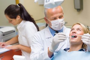Dentist with patient, Dental Bridge Selection